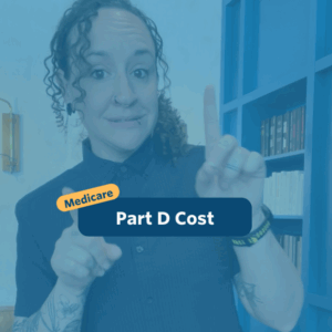The post has a video thumbnail with blue shading overlaid. The top middle has "Medicare: Part D Cost” in white text with light blue background, accompanied by a yellow bubble with “Medicare” in blue. In the video: A nonbinary person with long, curly brown hair tied to their right stands in front of the camera. Behind them is a light brown leather couch and a blue built-in bookshelf wall. They are wearing black pants, a dark navy button-up shirt, and a pair of small gold earrings.