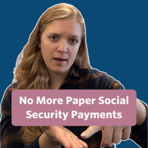 The post has a video thumbnail. The middle has a text bubble that reads “No More Paper Social Security Payments” in white text with rose background. In the video, a woman with blonde wavy hair is sitting in front of the camera with shelves, books, and decorative items behind her. She is wearing a navy blue and mustard yellow plaid button-up shirt.