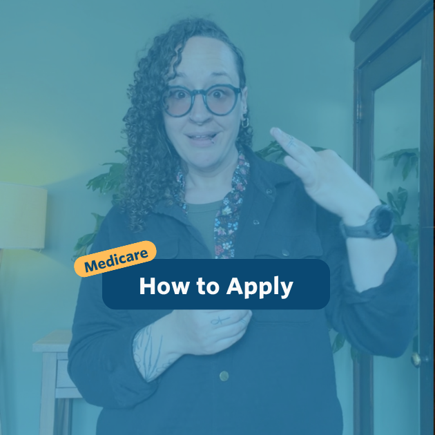 The post has a video thumbnail with blue shading overlaid. The top middle has "Medicare: How to Apply” in white text with light blue background, accompanied by a yellow bubble with “Medicare” in blue. In the video: A nonbinary person with long, curly brown hair that is shaved on the right side of their head stands in front of the camera. Behind them is a light wooden entry table with a potted monstera plant set against a green wall. They are wearing black pants, a black jacket over a floral button-down shirt, and a pair of tinted glasses.